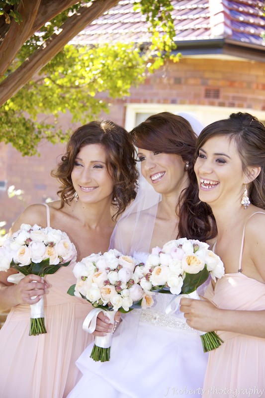 Bride and bridesmaids laughing - wedding photography sydney